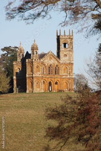 Vertical shot of Gothic temple in Stowe park under blue sky