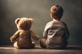 Little boy is sitting on the floor with his teddy bear, rear view of babysitting Toddler beside his teddy bear, AI Generated