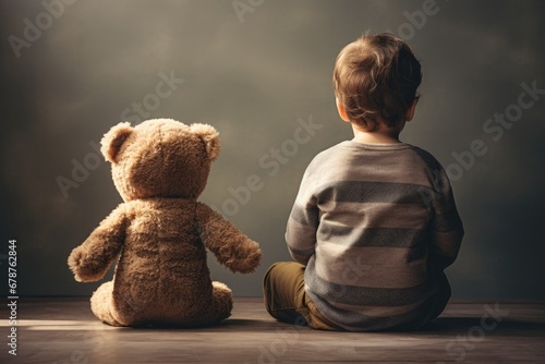 Little boy is sitting on the floor with his teddy bear, rear view of babysitting Toddler beside his teddy bear, AI Generated photo
