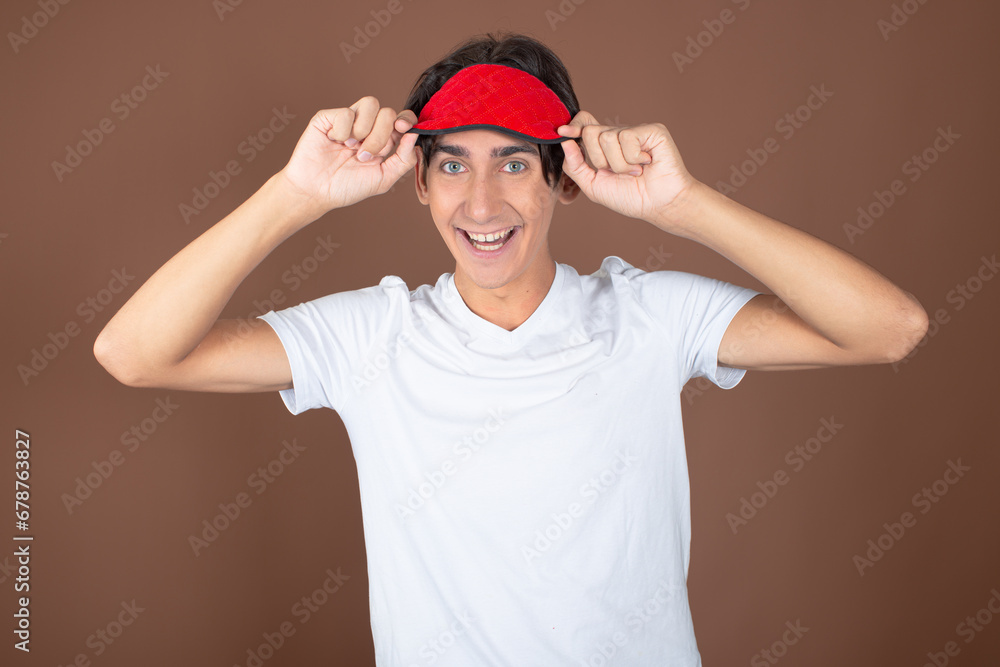 Funny attractive guy posing on a brown background. Funny attractive guy posing on a brown background.