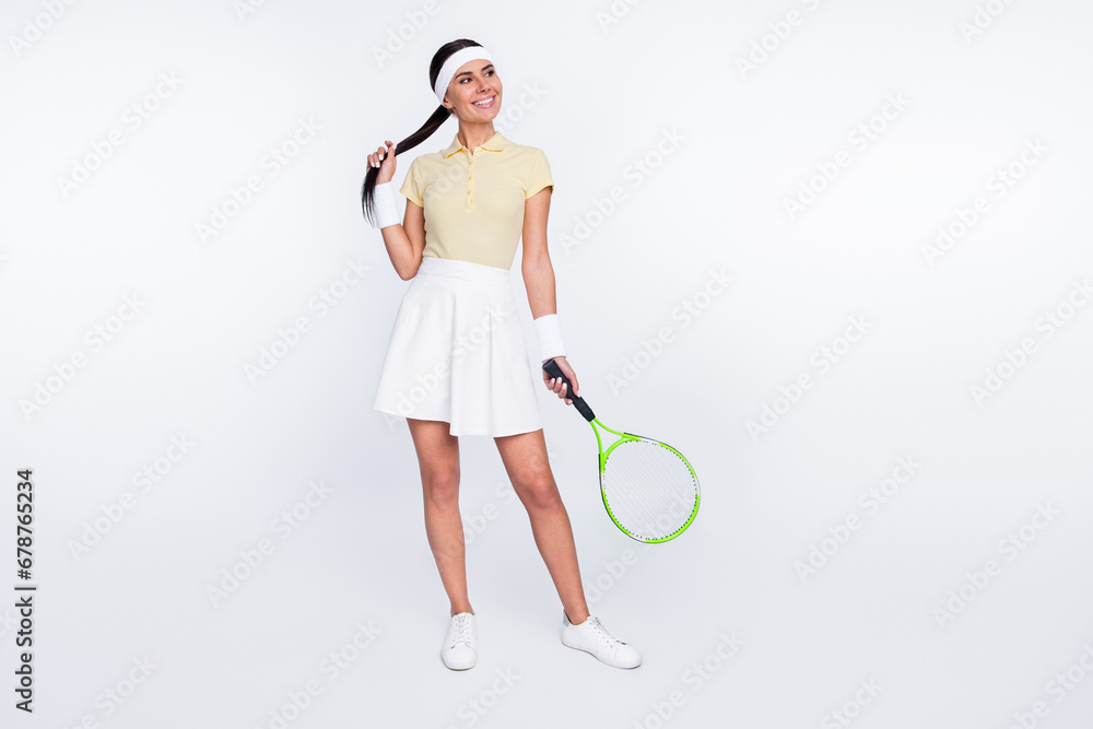 Full length body size view of pretty dreamy cheerful girl attending league tennis on court isolated over white color background