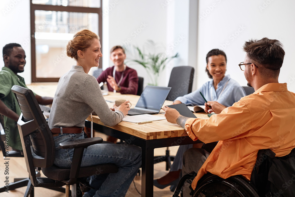 Business people working in team at meeting, they sitting at table and talking to manager with disability Business people working in team at meeting, they sitting at table and talking to manager with disability