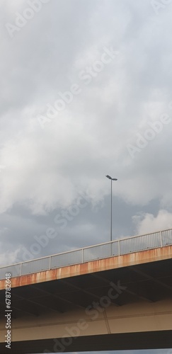 Stormy clouds over a single lamppost. Loneliness concepts 