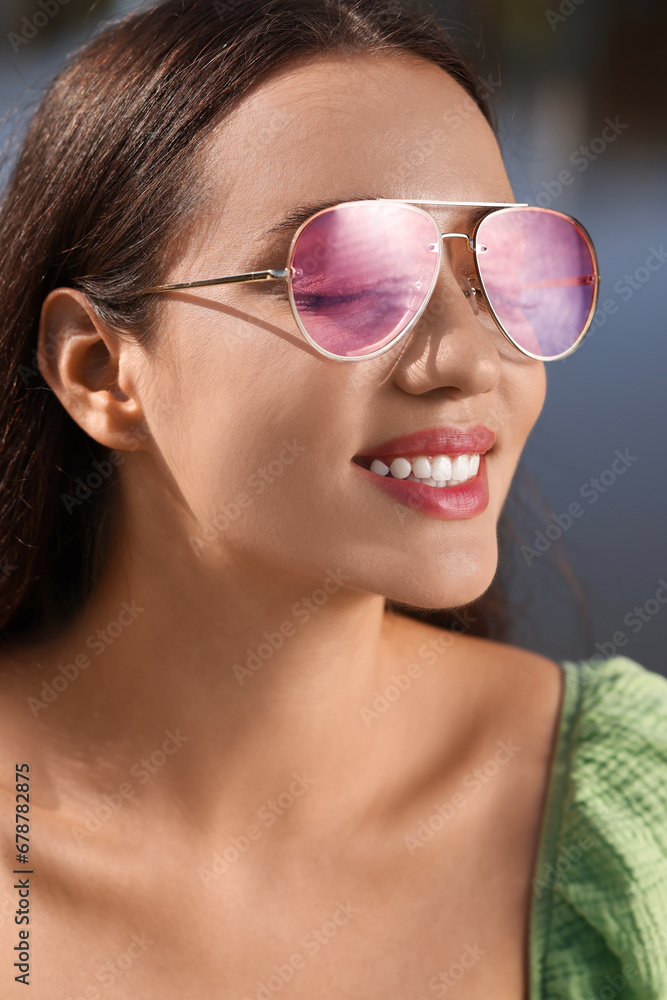 Beautiful woman in sunglasses outdoors on sunny day Beautiful woman in sunglasses outdoors on sunny day