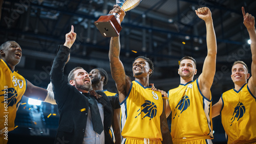 Multiethnic Basketball Players Celebrate Championship Victory with Hugs, Jumping, And Holding the Trophy. Exclusive Joyful Sports Action on Live TV and Pay Per View Internet Streaming Concept. photo