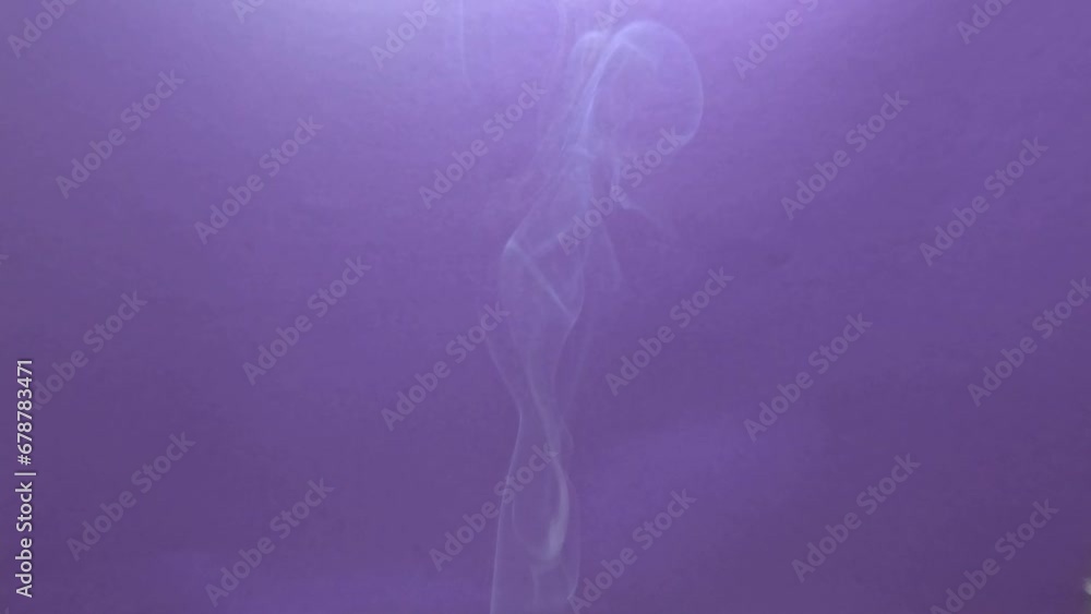 Smoke against a blue background in slow motion Smoke against a blue background in slow motion