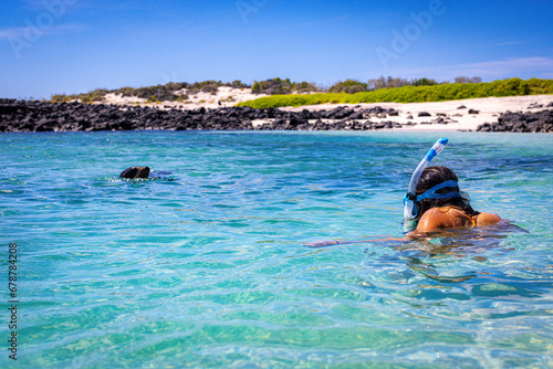 Woman snorkling with Sealion © Jef