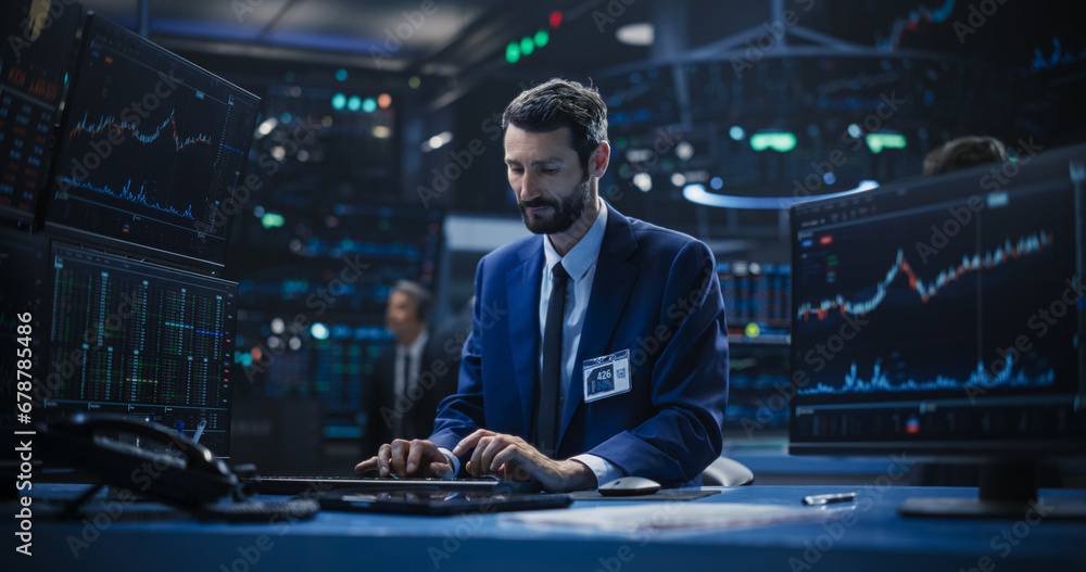Adult Stock Exchange Broker Working on a Desktop Computer with Real-Time Stock Information, Commodities and Exchange Market Charts. Professional Investor Communicating with Business Partners Online Adult Stock Exchange Broker Working on a Desktop Computer with Real-Time Stock Information, Commodities and Exchange Market Charts. Professional Investor Communicating with Business Partners Online