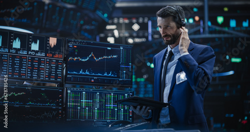 Portrait of a Stylish Man Working in an International Stock Exchange Company: Specialist Monitoring Equity and Share Markets, Communicating with Clients, Working with Corporate Business Partners