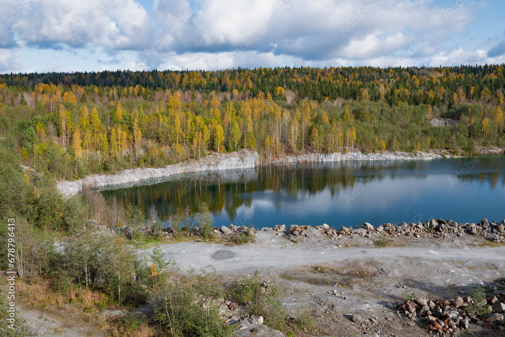 View of the old flooded marble quarry in the vicinity of Ruskeala in golden autumn. Karelia, Russia