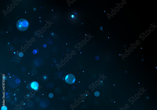 Blurred bokeh effect on black background. Sparkling magical particles.