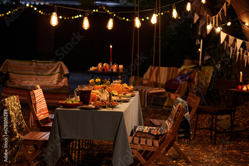 Festive table with food and drinks to celebrate party outdoors