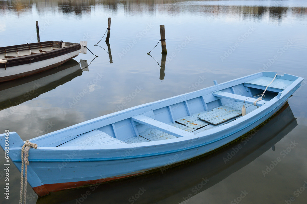 Old wooden traditional fishing boat in shallow water, authentic fishing boat from Nin, Croatia Old wooden traditional fishing boat in shallow water, authentic fishing boat from Nin, Croatia