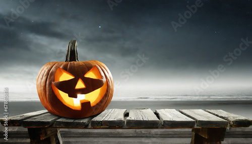 one spooky halloween pumpkin jack o lantern with an evil face and eyes on a wooden bench table with a misty gray coastal night background with space for product placement