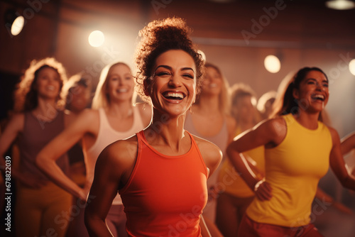 beautiful women enjoying a joyful dance class, candidly expressing their active lifestyle through Zumba with friends photo