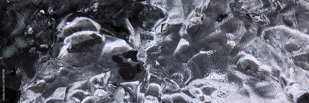 Abstract structure of a transparent block of ice. Graphic, monochrome background. Abstract structure of a transparent block of ice. Graphic, monochrome background.