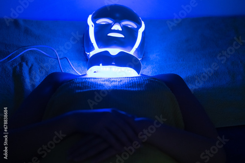 Photodynamic therapy facial mask on woman's face photo