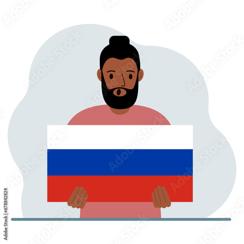 A man holds a Russian flag in his hands. The concept of demonstration, national holiday or patriotism. Nationality.
