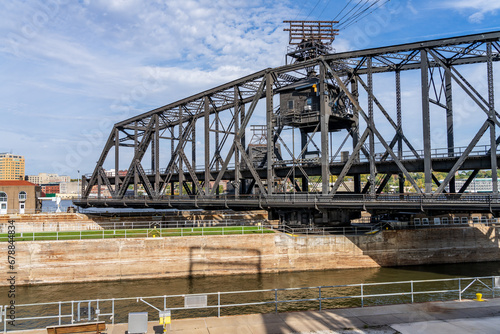 Historic swing span of the Arsenal or Government bridge swings open over the Lock and Dam No. 15 in Davenport, Iowa