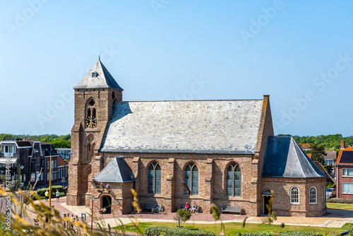 The Catharina Church on the Willibrordusplein in Zoutelande, Zeeland photo