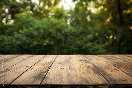 Wooden table surface with blurred forest backdrop