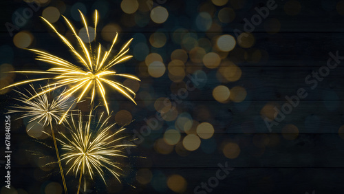 HAPPY NEW YEAR - Sylvester, New Year's Eve 2024 Party, New year, Firework celebration background banner - Golden fireworks and bokeh lights on dark rustic wooden wall texture in the night.