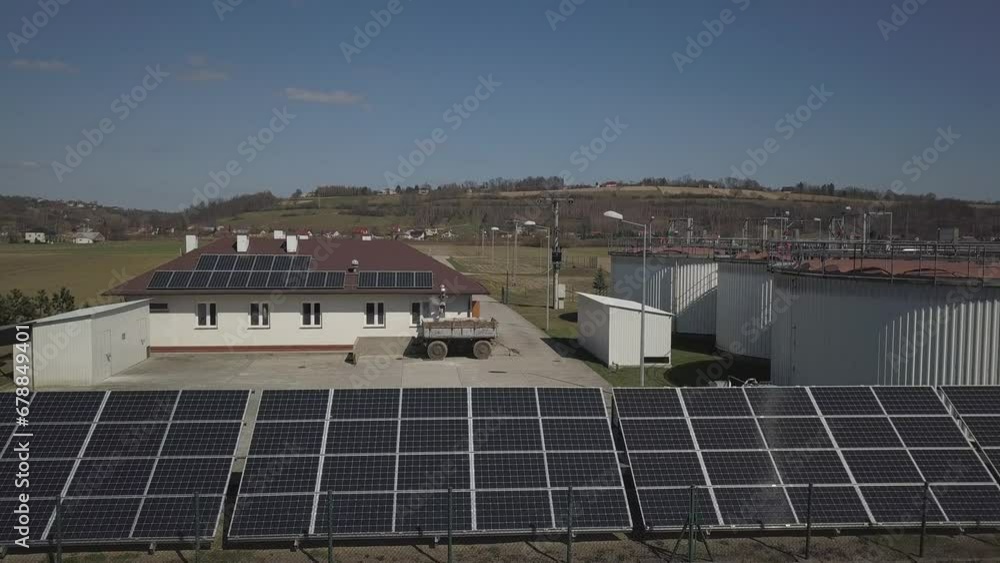 Flying over a sewage treatment plant from a bird's eye view. The sewage treatment plant is equipped with solar panels to obtain ecological energy for the operation of the filters. Flying over a sewage treatment plant from a bird's eye view. The sewage treatment plant is equipped with solar panels to obtain ecological energy for the operation of the filters.
