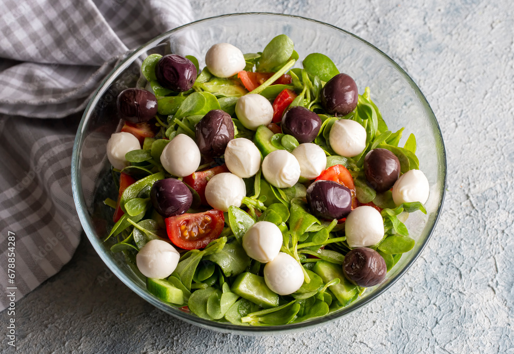 Purslane salad with cheese balls and olives inside. Healthy diet salad. Purslane salad with cheese balls and olives inside. Healthy diet salad.