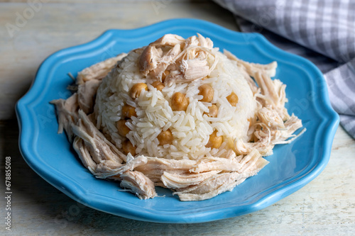 Traditional delicious Turkish food; Rice with chickpeas and chicken (Turkish name; Tavuklu nohutlu pilav or pilaf) photo