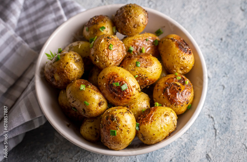 Roasted baked baby potatoes with garlic and herbs.