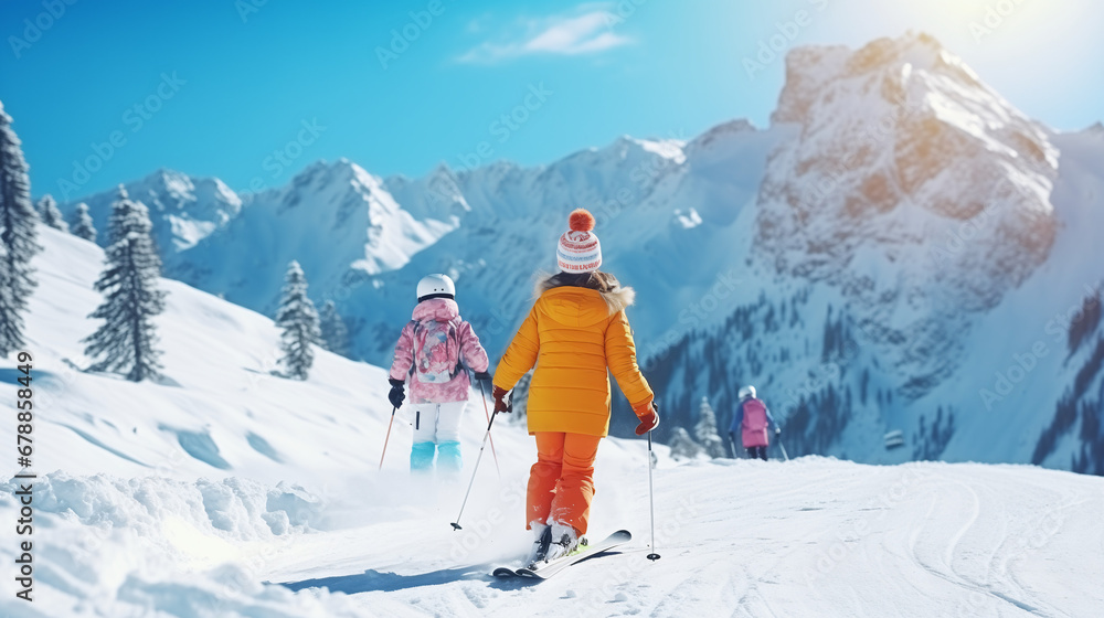 
Child skiing in the mountains. Kid in ski school. Winter sport for kids. Family Christmas vacation in the Alps. Children learn downhill skiing. Alpine ski lesson for boy and girl. Outdoor snow fun.