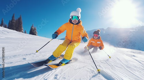 
Child skiing in the mountains. Kid in ski school. Winter sport for kids. Family Christmas vacation in the Alps. Children learn downhill skiing. Alpine ski lesson for boy and girl. Outdoor snow fun. photo