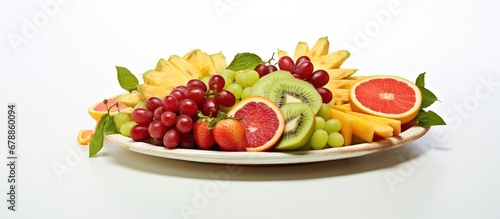 In the isolated white background of an exquisite design a platter of healthy tropical fruit with vibrant green red and white colored slices beckons in the summer heat offering a refreshing 