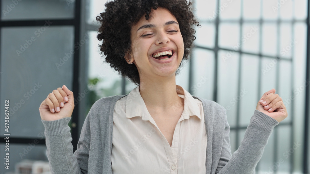 Happy excited young woman student or employee, office worker winner using laptop Happy excited young woman student or employee, office worker winner using laptop