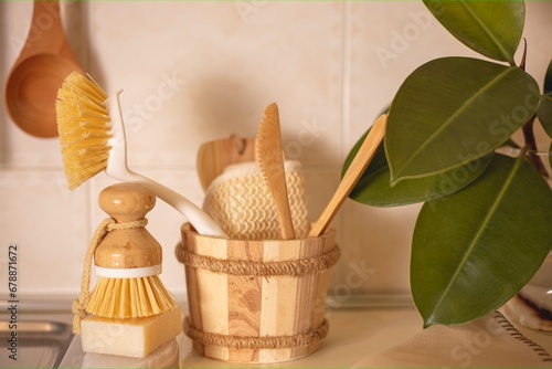  Eco-friendly accessories natural cleaning products , bamboo dish brushes. No plastic, green lifestyle.The concept of cleaning the kitchen zero waste. photo