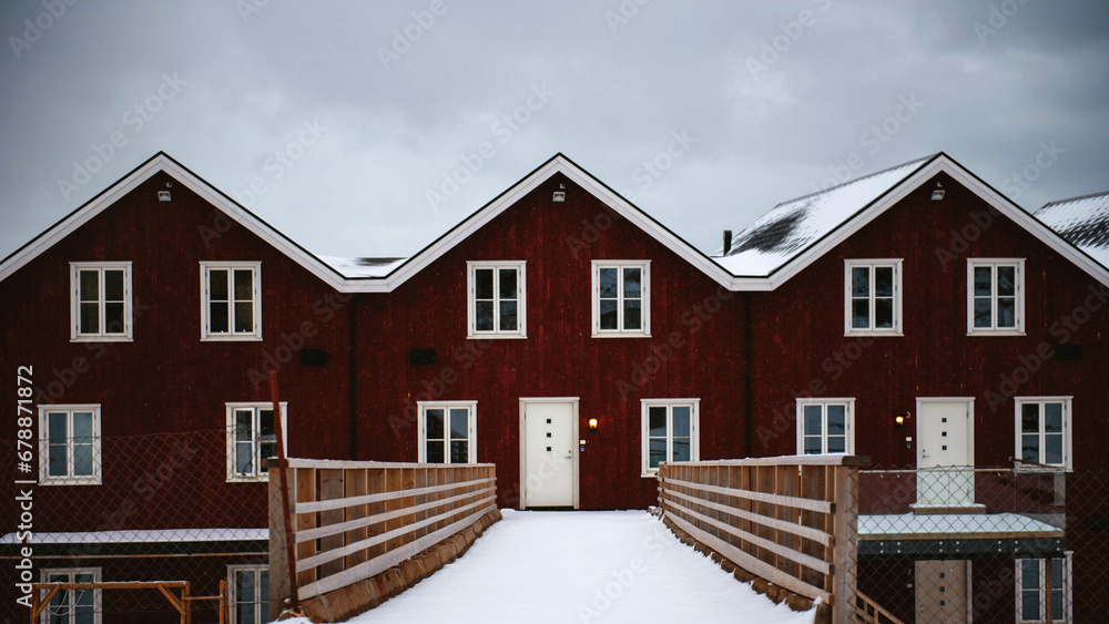 Obraz premium Traditional red norwegian houses covered with snow