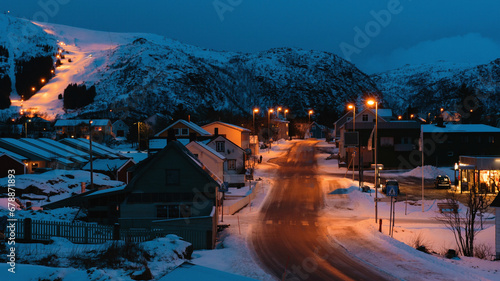 Fototapeta Naklejka Na Ścianę i Meble -  Small village with snowy mountains during evening time