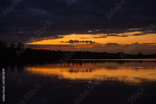 sunset over the lake.tranquil landscape © alipko