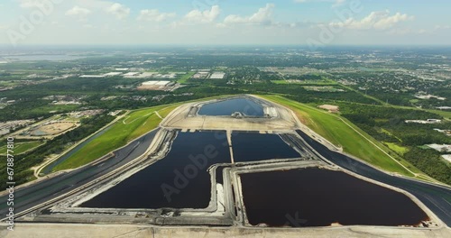 Industrial phosphogypsum stack for chemical waste storage near Tampa, Florida. Disposing and piling up byproduct of phosphate fertilizer production photo