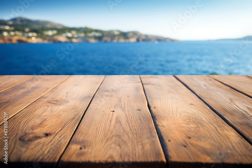 wooden tabletop overlooking blurred ocean landscape background, copy space