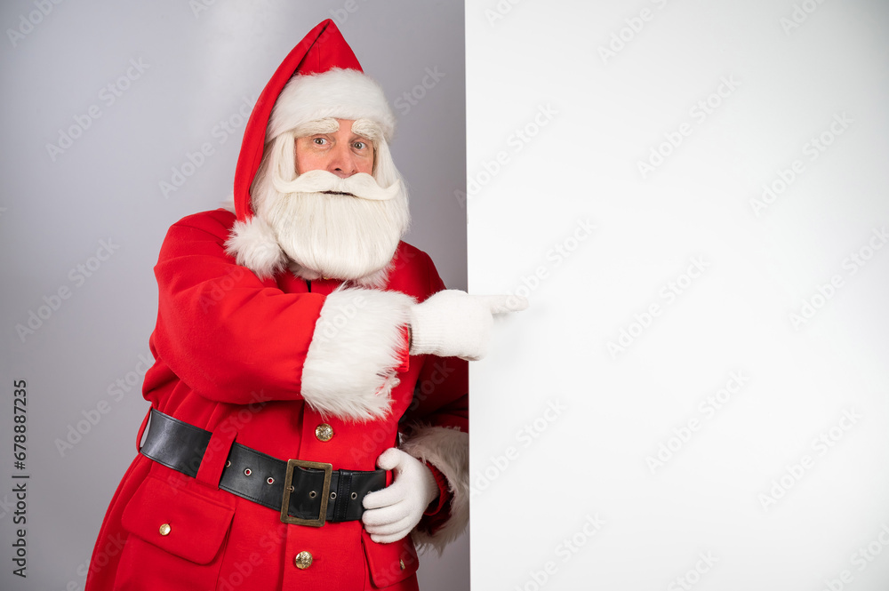 Santa claus points to an empty space. Christmas advertisement. Santa claus points to an empty space. Christmas advertisement.