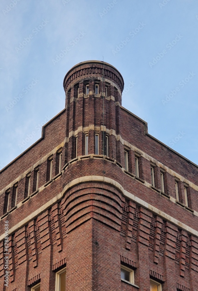 Vertical shot of an old architecture against blue sky