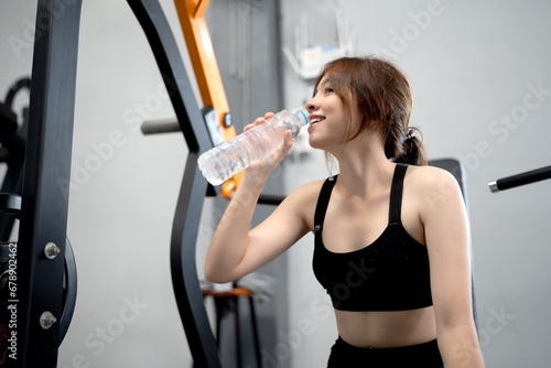 happy young woman holding drinking water © angkhan
