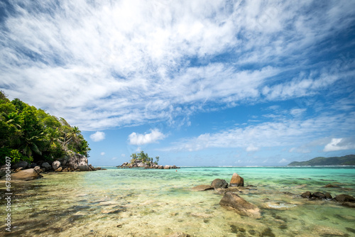 View of nice tropical beach with palms and granite rocks. Holiday and vacation concept. Tropical beach. Mahe Island, Seychelles. Anse Roayle photo