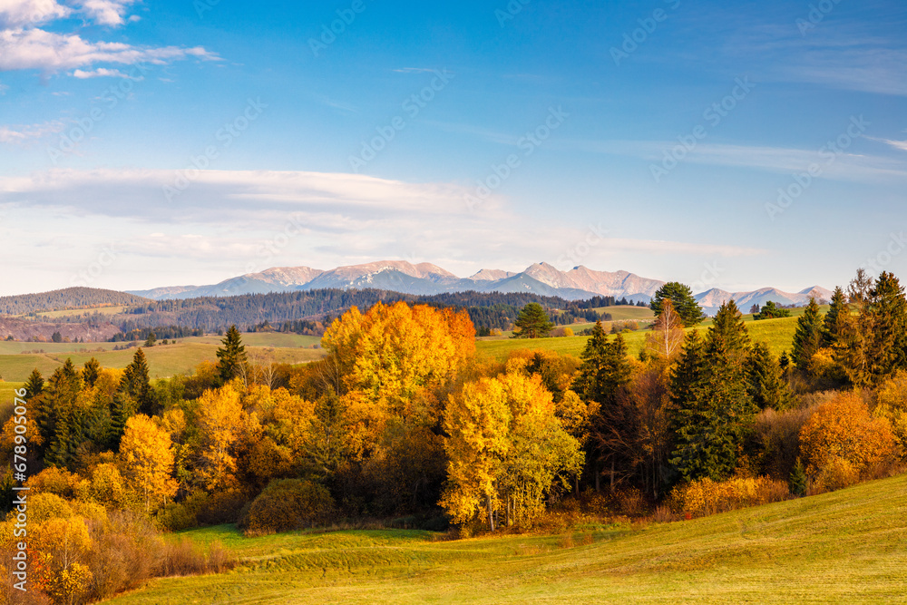 Autumn rural landscape with The Western Tatras mountains in Slovakia at sunset in a background. The Orava region of Slovakia, Europe.