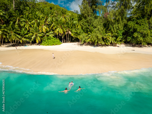 Paradise Sunny beach with palms and turquoise sea. Summer vacation and tropical beach concept. Seyshelles, Anse Solei photo