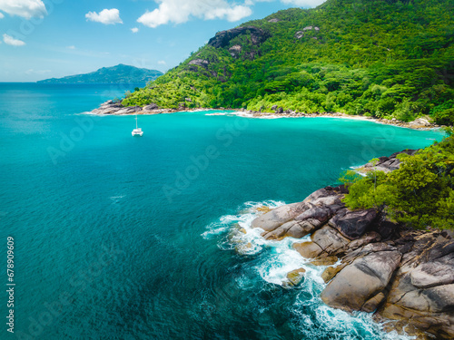 Big granite rocks and turquoise ocean water. Summer landscape on a tropical island. Tropical landscape with sunny sky. Seyshelles, Mahe photo