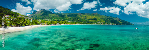 Panoramic landscape of the popular Beau Vallon Beach of Mahe island, Seychelles. Tropical beach in the Indian ocean, travel postcard