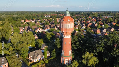 Aerial view of beautiful houses near the forest on a sunny day photo