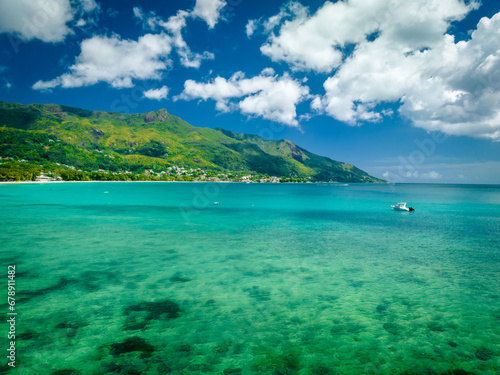 Panoramic landscape of the popular Beau Vallon Beach of Mahe island, Seychelles. Tropical beach in the Indian ocean, travel postcard